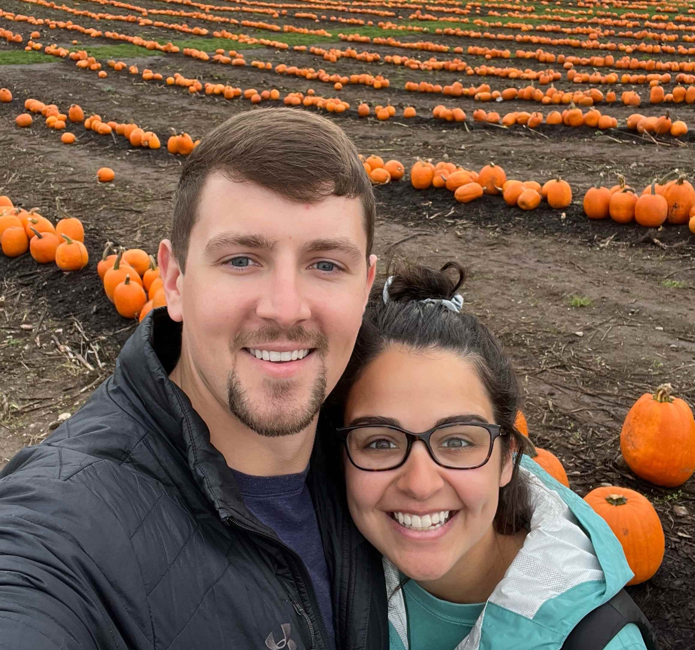 Vince and Jenna out in a pumpkin patch